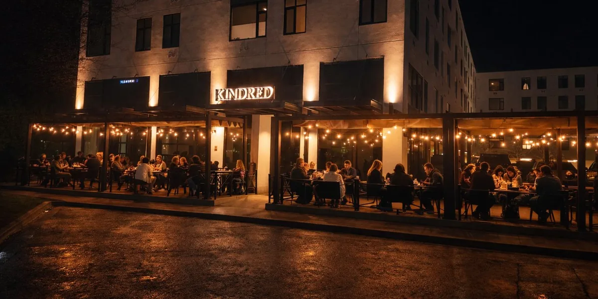 Kindred by the Creek at night — lit patio on Main Street, downtown Caldwell